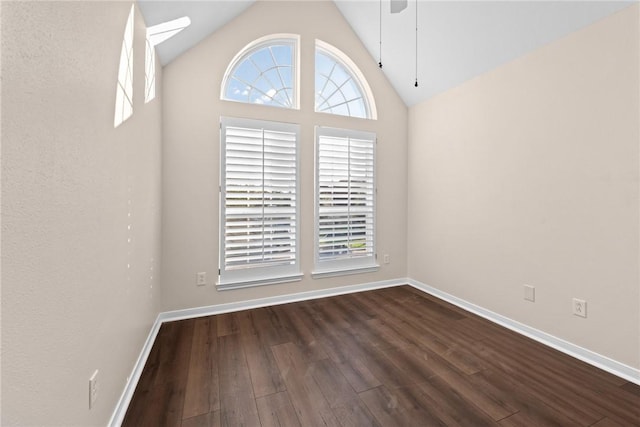 unfurnished room featuring dark hardwood / wood-style flooring, high vaulted ceiling, and ceiling fan