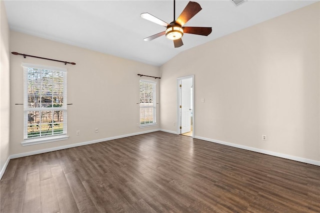 empty room featuring lofted ceiling, ceiling fan, and dark wood-type flooring