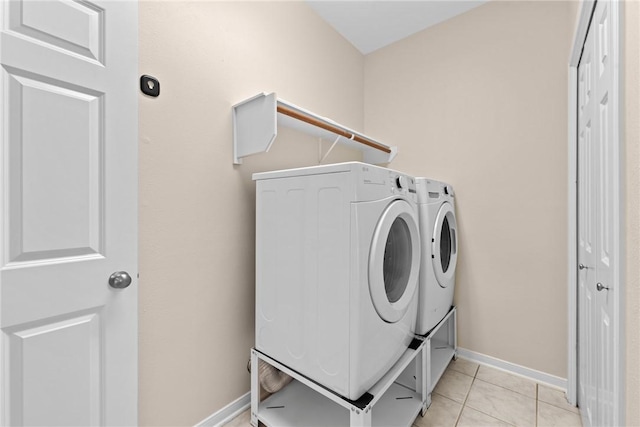 5115 Bellerive Bend Dr, College Station, TX 77845 - washroom with independent washer and dryer, light tile patterned floors, and baseboards
