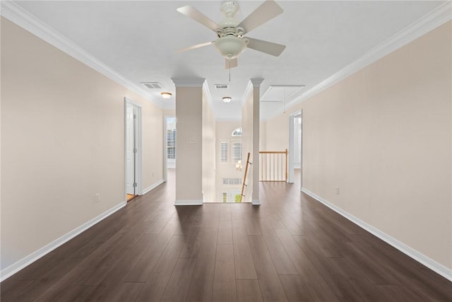 empty room featuring ceiling fan, dark hardwood / wood-style flooring, and crown molding