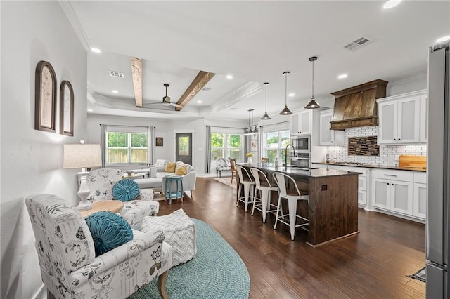 2987 Archer Dr, Bryan, TX 77808 - living room with a ceiling fan, crown molding, dark wood finished floors, and recessed lighting