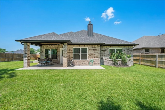 2987 Archer Dr, Bryan, TX 77808 - rear view of property featuring brick siding, a chimney, a patio, and roof with shingles