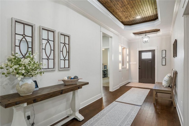 2987 Archer Dr, Bryan, TX 77808 - foyer entrance featuring wooden ceiling, dark wood-style flooring, baseboards, crown molding, and a raised ceiling
