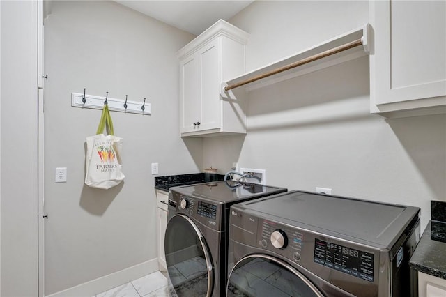 2987 Archer Dr, Bryan, TX 77808 - washroom featuring independent washer and dryer, cabinet space, baseboards, and marble look tile flooring
