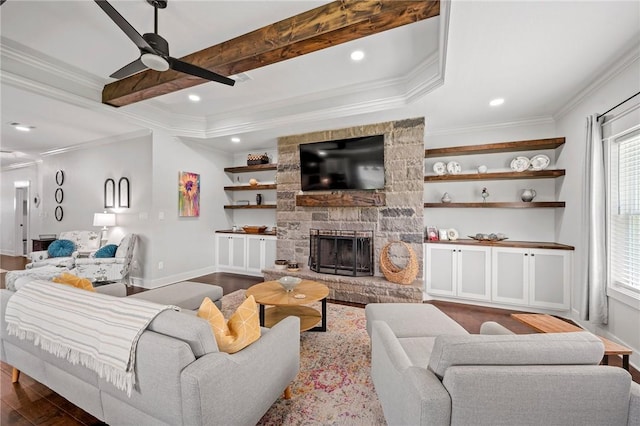 2987 Archer Dr, Bryan, TX 77808 - living room with ceiling fan, dark wood-type flooring, crown molding, a fireplace, and baseboards