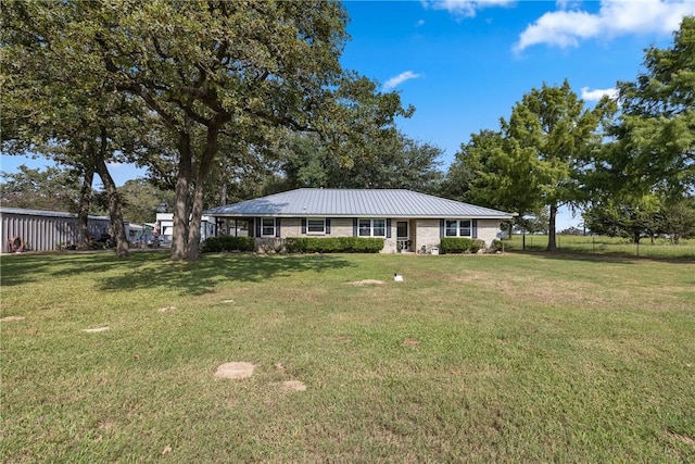 ranch-style home with a front yard