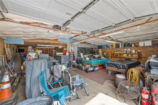 garage featuring wooden walls