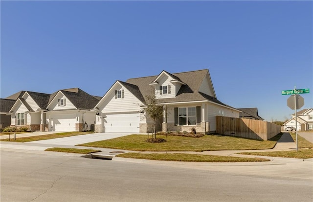 view of front of property featuring a garage and a front lawn