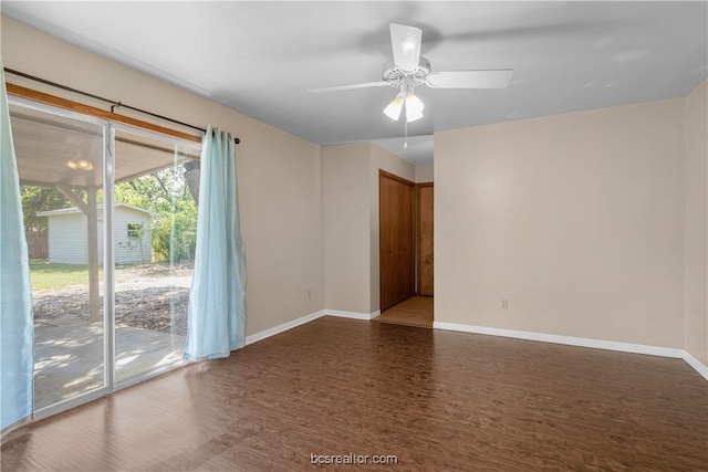 spare room with ceiling fan and dark wood-type flooring