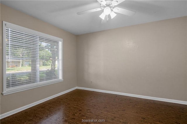 spare room with ceiling fan and wood-type flooring