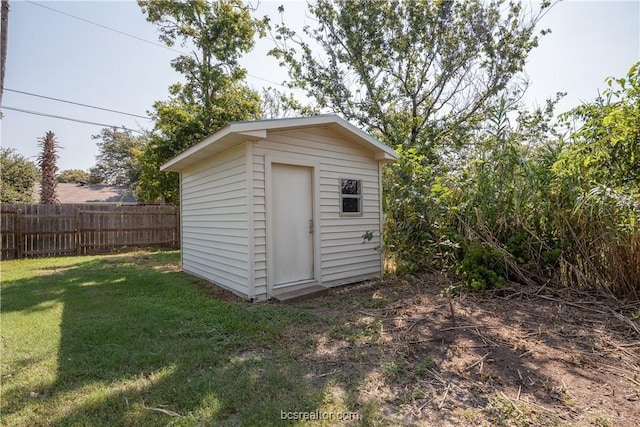 view of outdoor structure with a yard