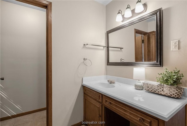 bathroom with tile patterned flooring and vanity