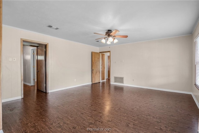 spare room with ceiling fan, dark hardwood / wood-style floors, and ornamental molding