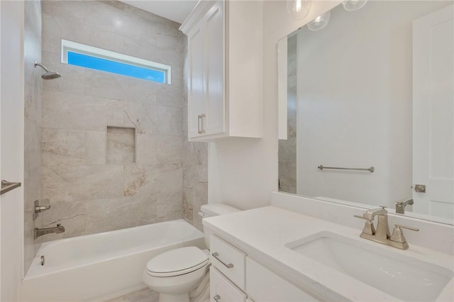 full bathroom with tiled shower / bath, vanity, and toilet