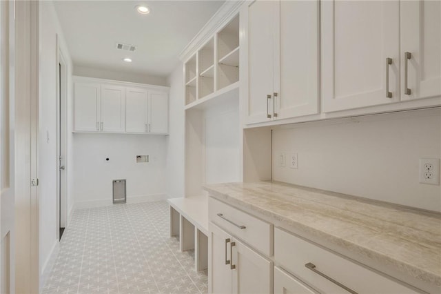 washroom featuring cabinets and hookup for a washing machine