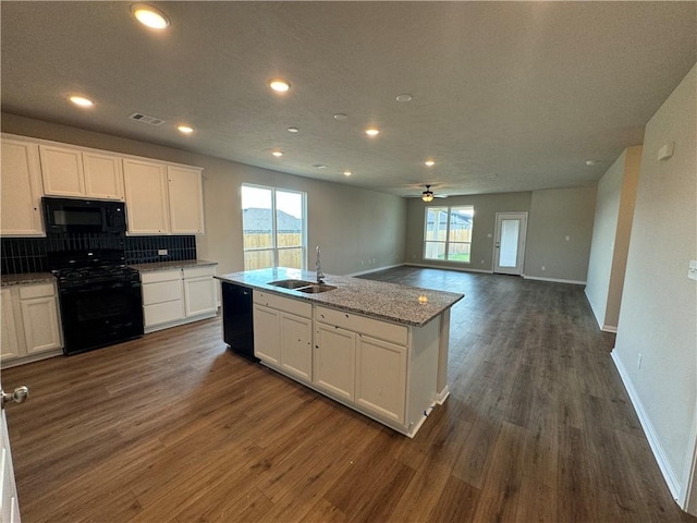 kitchen featuring black appliances, white cabinets, sink, and dark wood-type flooring