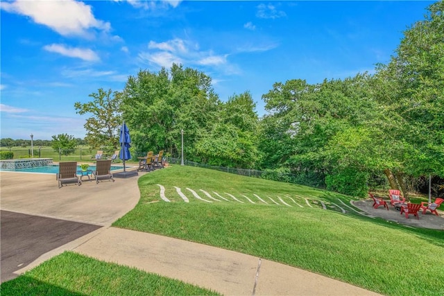 4920 Whistling Straits Loop, College Station, TX 77845 - view of yard featuring a patio and an outdoor pool