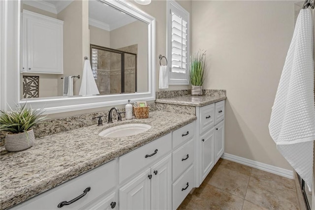 4920 Whistling Straits Loop, College Station, TX 77845 - full bath with vanity, a stall shower, ornamental molding, and tile patterned flooring