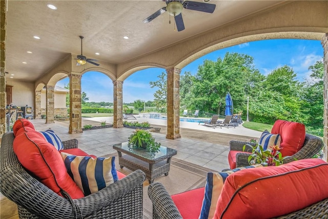 4920 Whistling Straits Loop, College Station, TX 77845 - view of patio with ceiling fan, an outdoor living space, and an outdoor pool
