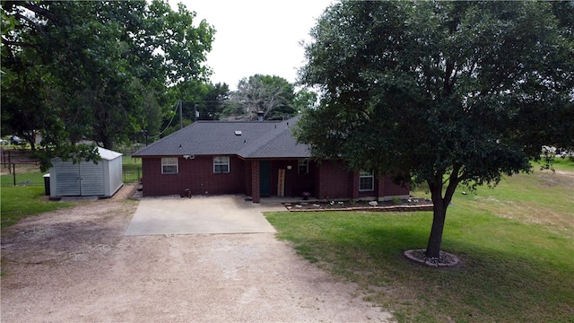 7314 Dilly Shaw Tap Rd, Bryan, TX 77808 - single story home with a front lawn, driveway, and brick siding
