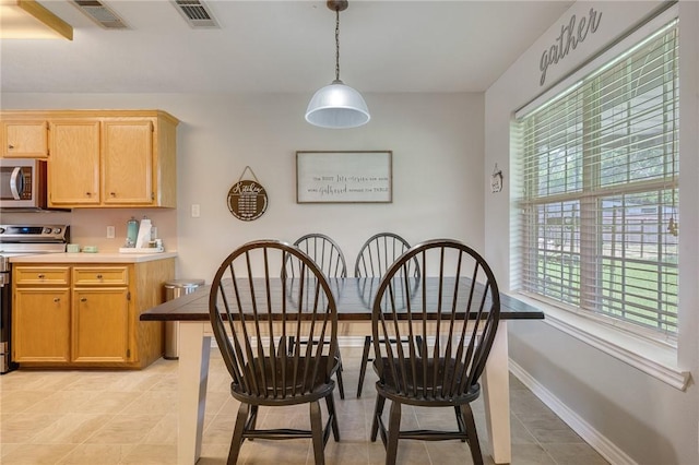 7314 Dilly Shaw Tap Rd, Bryan, TX 77808 - dining room with light tile patterned floors and baseboards