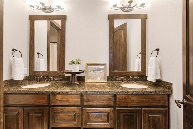 bathroom featuring double vanity and a sink