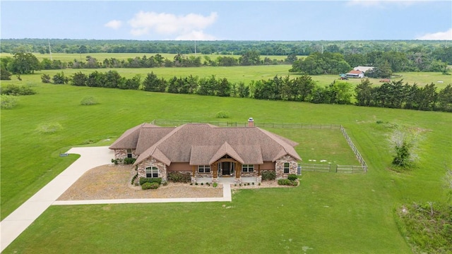 birds eye view of property with a rural view