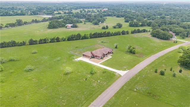 birds eye view of property with a rural view
