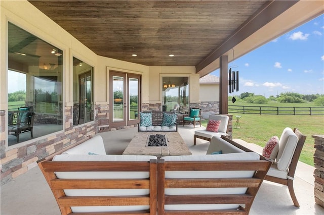 view of patio featuring fence and an outdoor hangout area
