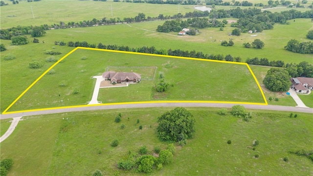birds eye view of property featuring a rural view