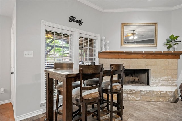 912 Emerald Dove Ave, College Station, TX 77845 - bar area featuring a fireplace, ornamental molding, baseboards, wood finished floors, and a ceiling fan