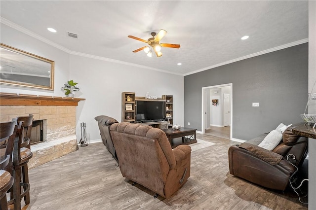 912 Emerald Dove Ave, College Station, TX 77845 - living area with ceiling fan, wood finished floors, recessed lighting, baseboards, and a fireplace