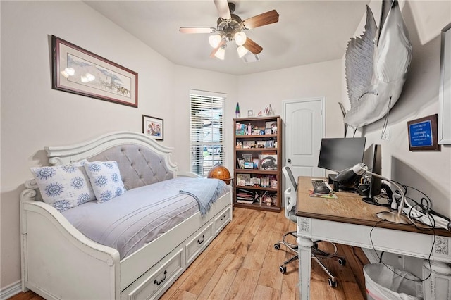 912 Emerald Dove Ave, College Station, TX 77845 - bedroom featuring light wood finished floors, an office area, and a ceiling fan