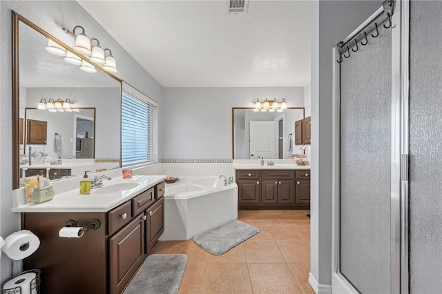 912 Emerald Dove Ave, College Station, TX 77845 - full bathroom with tile patterned flooring, a bath, a stall shower, and two vanities