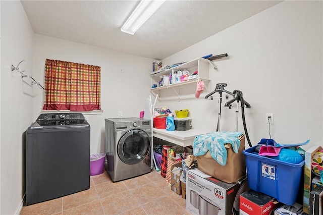 912 Emerald Dove Ave, College Station, TX 77845 - washroom featuring independent washer and dryer and tile patterned floors