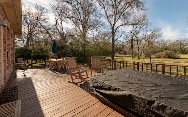 wooden terrace with outdoor dining space