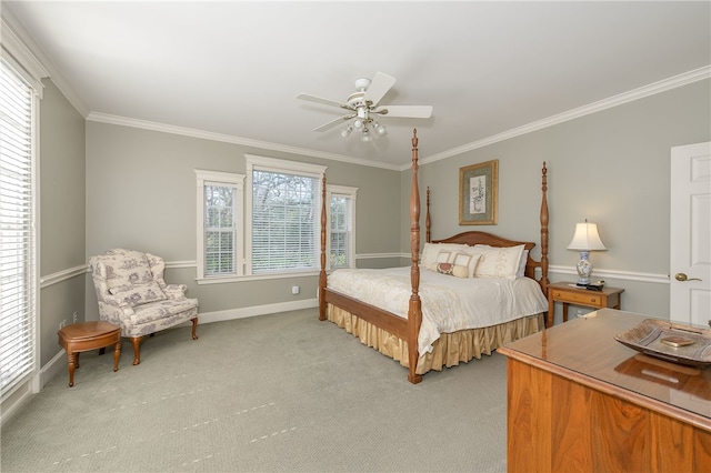 bedroom with light colored carpet, crown molding, baseboards, and ceiling fan