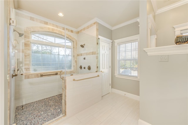 bathroom featuring baseboards, a shower stall, and crown molding