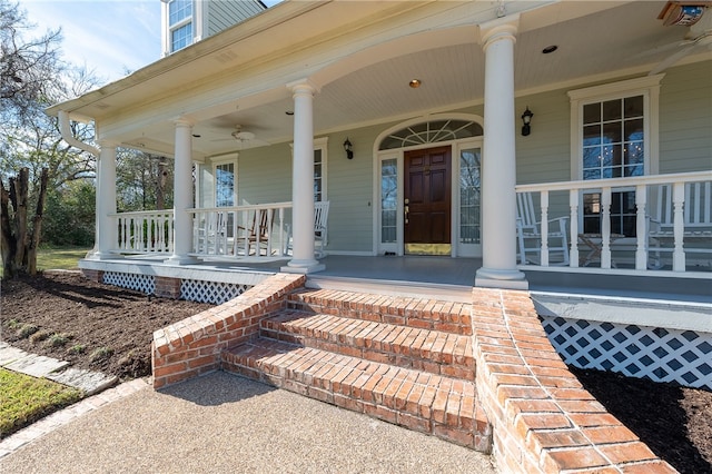 property entrance featuring a porch and a ceiling fan