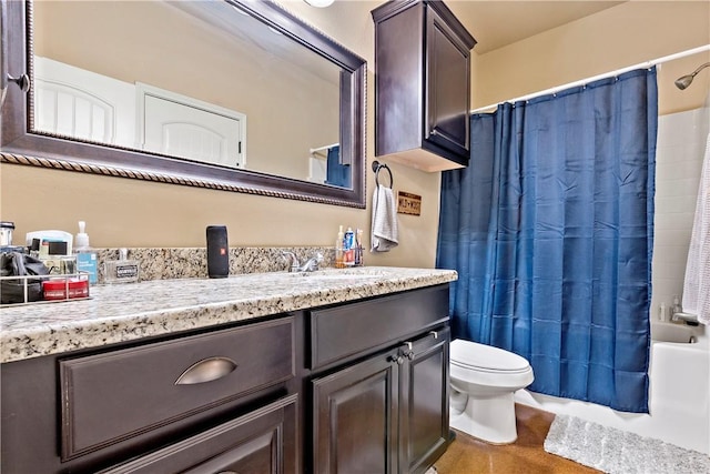 full bathroom with vanity, shower / bath combo with shower curtain, and toilet