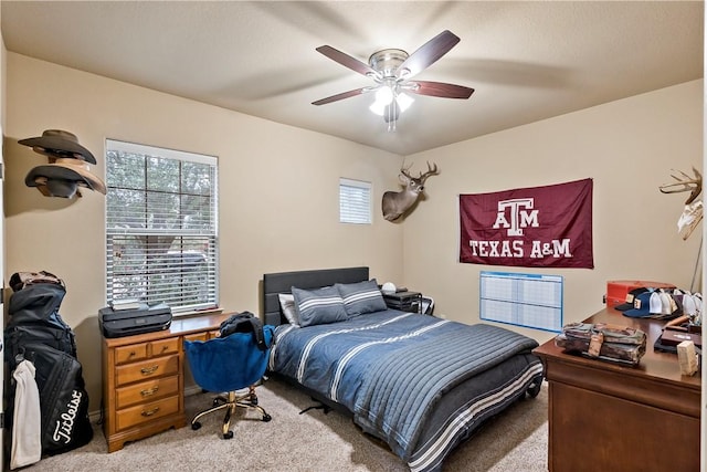 carpeted bedroom featuring ceiling fan