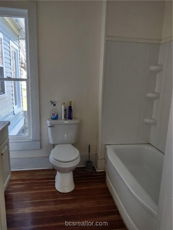 bathroom with hardwood / wood-style floors, vanity, and toilet