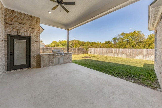 view of patio / terrace featuring a grill and ceiling fan