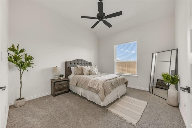 carpeted bedroom with ceiling fan and lofted ceiling