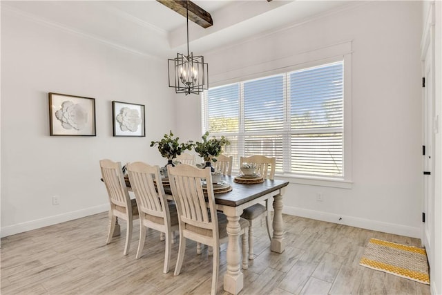 dining area featuring ornamental molding, beamed ceiling, light hardwood / wood-style floors, and a notable chandelier