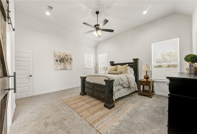 bedroom with ceiling fan, light carpet, and vaulted ceiling