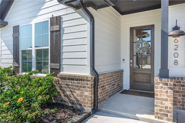 property entrance featuring covered porch