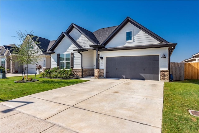 view of front facade with a front yard and a garage