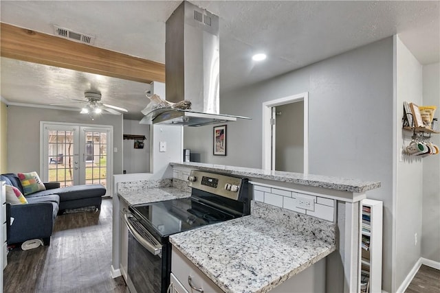 kitchen featuring french doors, dark wood finished floors, visible vents, stainless steel range with electric cooktop, and island range hood