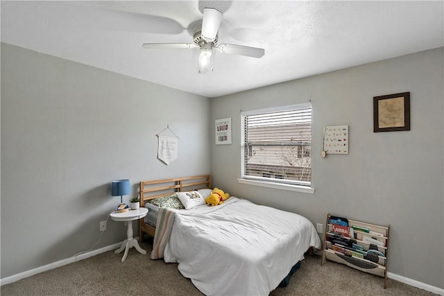 carpeted bedroom featuring ceiling fan and baseboards